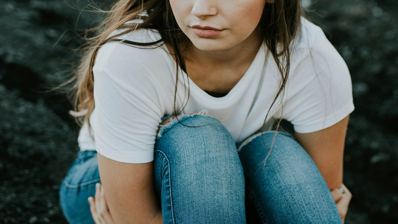 woman struggling with mental health issues.