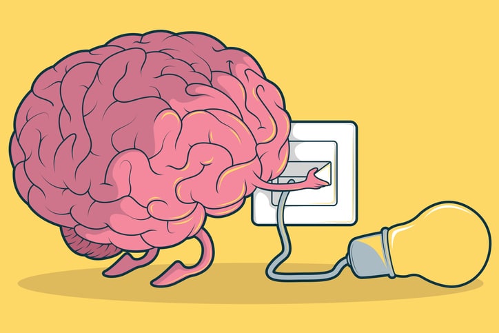 Brain plugging in a light blub.